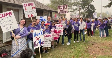 People standing with picket signs