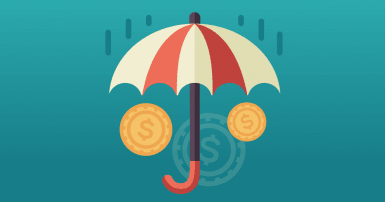 Un parapluie rouge et blanc protège des pièces de monnaie de la pluie