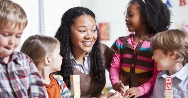 Image: Child care worker with children