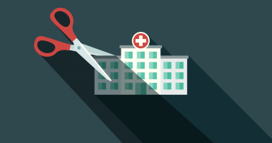 Simple illustration of a hospital building with giant scissors poised to cut it in half
