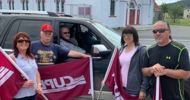 Former Placentia mayors Bill Horgan and Wayne Power Jr. with CUPE members
