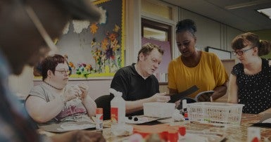 Clients and workers at a table