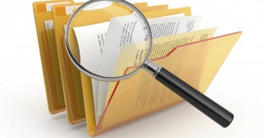 magnifying glass and photos