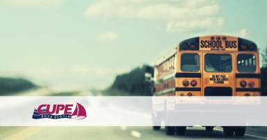 Web banner. No text. Image of school bus on a highway, with the CUPE Nova Scotia