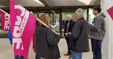 CUPE members picket outside wine and cheese