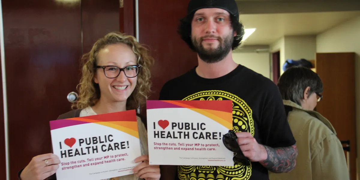 CUPE members holding "I <3 Public Health Care" signs