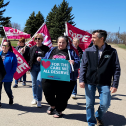 People marching with signs and flags