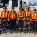 Guys standing in front of a truck