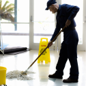 Custodian mopping school floors