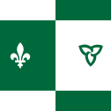 Franco Ontario flag, solid green background on left with white fleur-de-lys, white background on right with green trillium