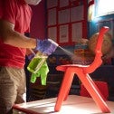 School custodian cleaning a chair