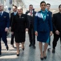 Flight attendants walk through airport