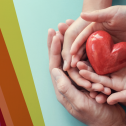 A heart being held by hands