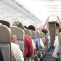 Passengers seated on an airplane Passengers seated on an airplane