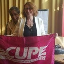 CUPE member Sheryl Burns with Faustina Van Aperen of the ILO in Geneva
