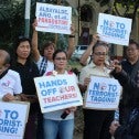 Alliance of Concerned Teachers rally in the Philippines with signs that  say "No to terrorist tagging"and "Hands off our teachers."