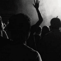 Black and white image of a crowd of people from the back