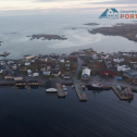 Aerial photo of Channel-Port aux Basques, NL, with a the town's text logo superimposed on the photo.