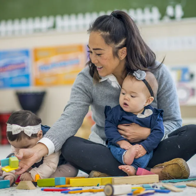 Child care worker with children