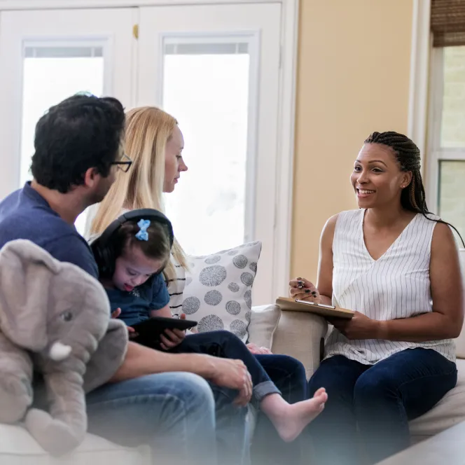 Worker interviewing family