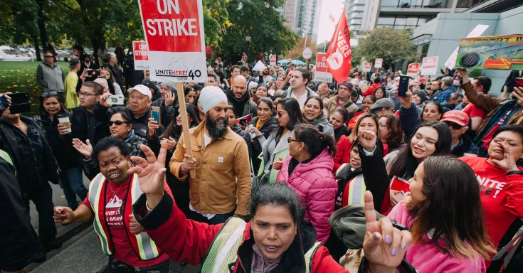 NDP Leader Jagmeet Singh in a crowd of picketers