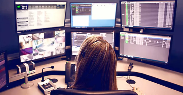 Telecommunications workers at a screen