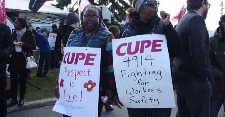 Image:  Striking members of CUPE 4914