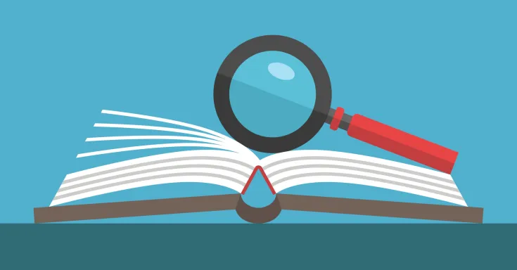 Magnifying glass resting on an open book