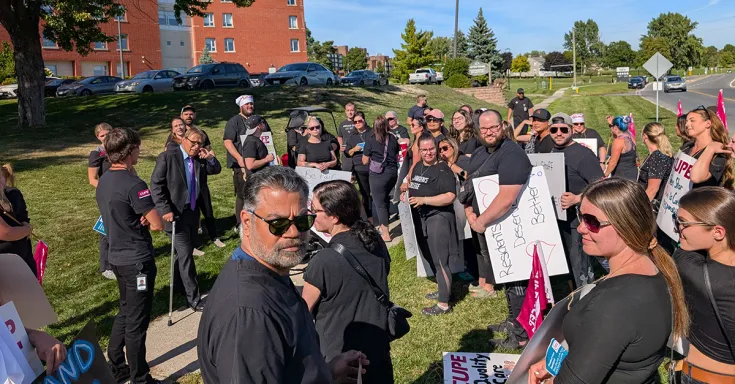 People standing at a rally