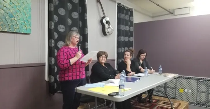 Discussion panel at townhall in Grenfell