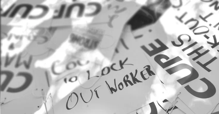 Picket signs in a pile