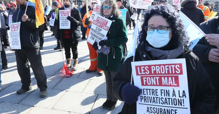 People holding protest signs