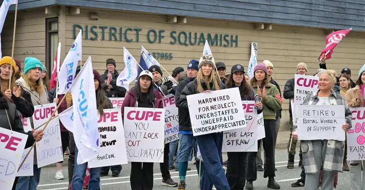 People standing with picket signs 
